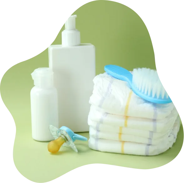 Baby care essentials: bottles, diapers and a grooming brush